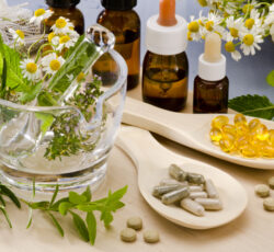 Alternative,medicine.,rosemary,,mint,,chamomile,,thyme,in,a,glass,mortar.